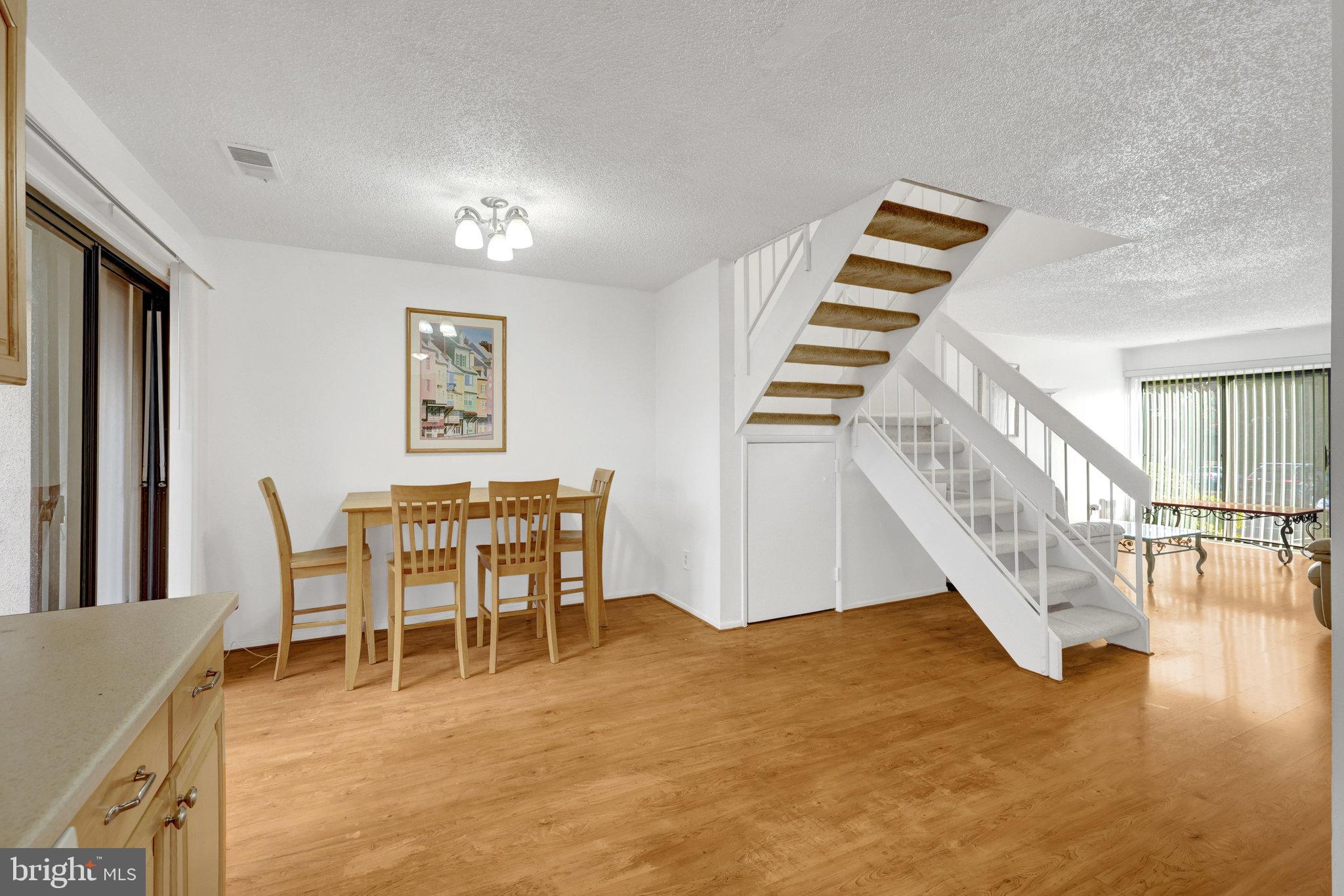 2142 Cartwright Place Reston, VA 20191 - Photo 13 of 46 a dining room with furniture and entryway