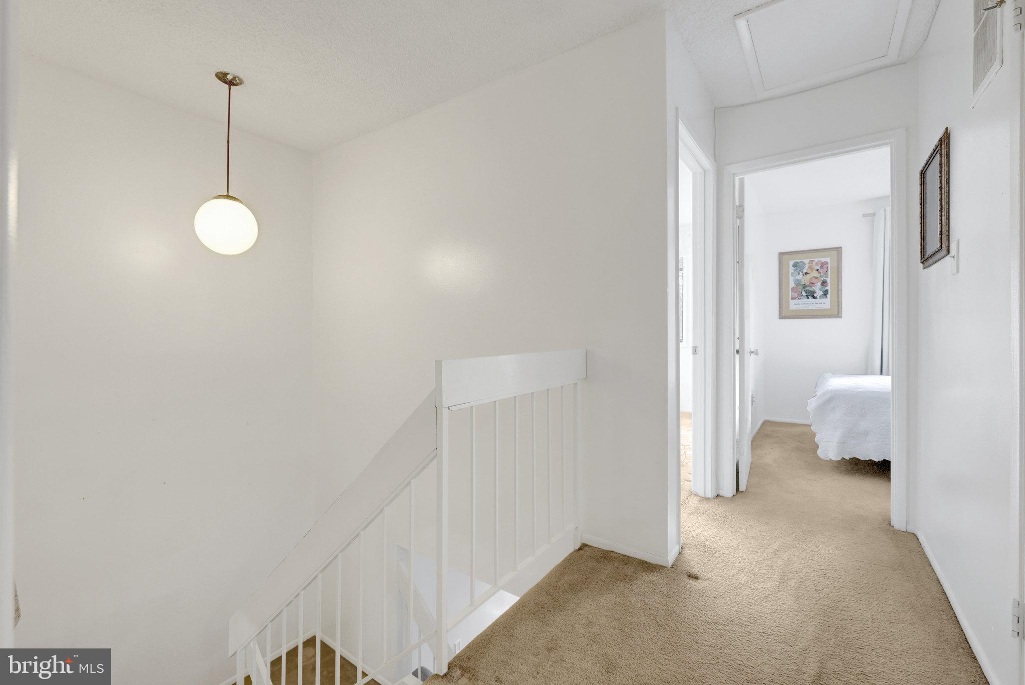 2142 Cartwright Place Reston, VA 20191 - Photo 20 of 46 a view of a bedroom from a hallway