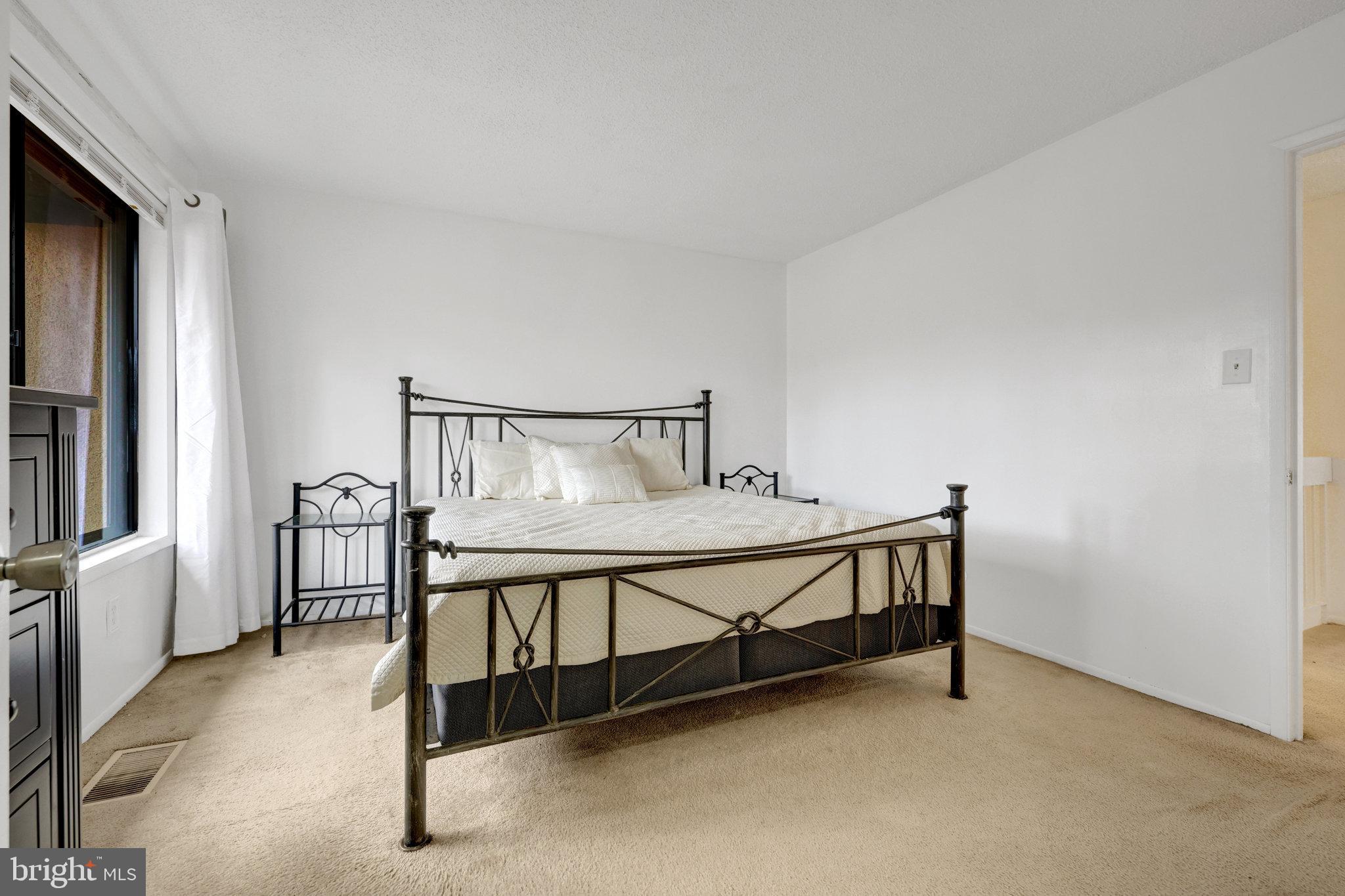 2142 Cartwright Place Reston, VA 20191 - Photo 23 of 46 a bedroom with furniture and a window