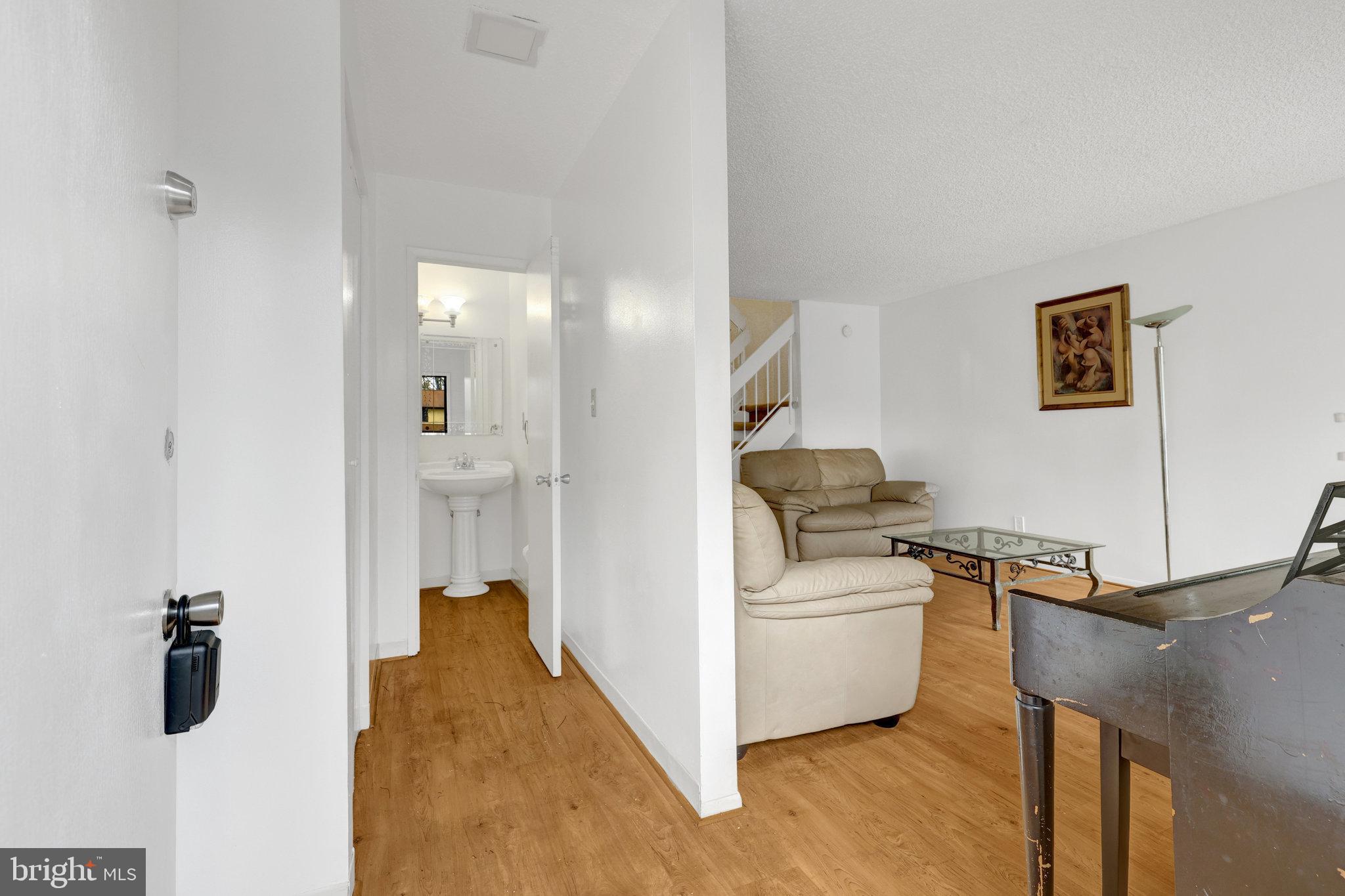 2142 Cartwright Place Reston, VA 20191 - Photo 3 of 46 a living room with furniture and a table