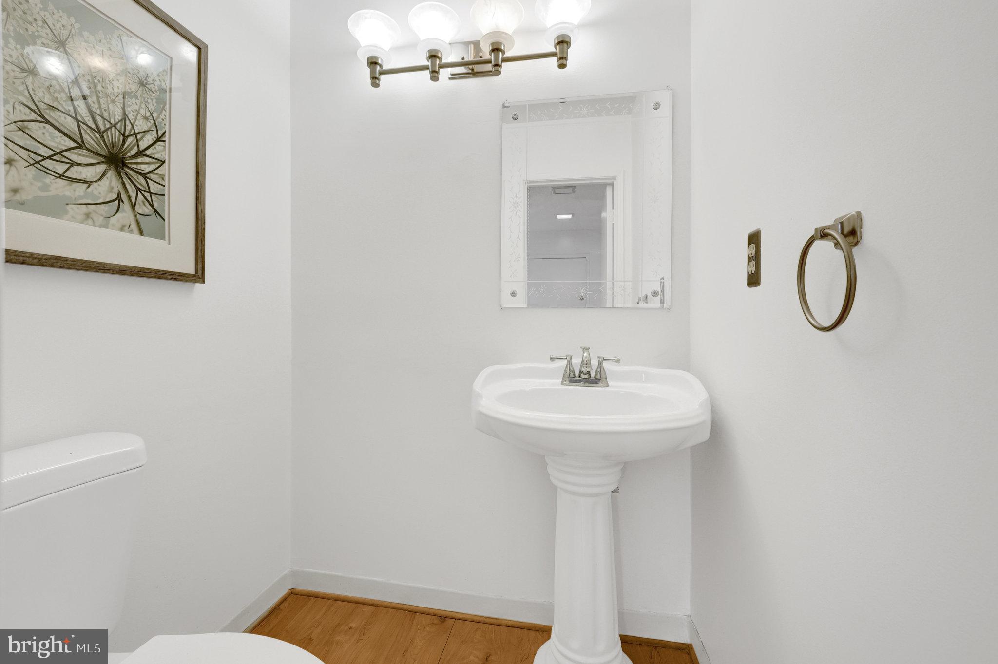 2142 Cartwright Place Reston, VA 20191 - Photo 5 of 46 a bathroom with a sink a toilet and mirror