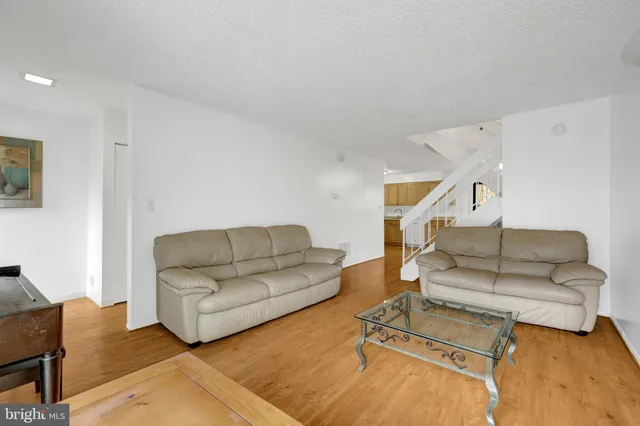 a living room with furniture and white walls