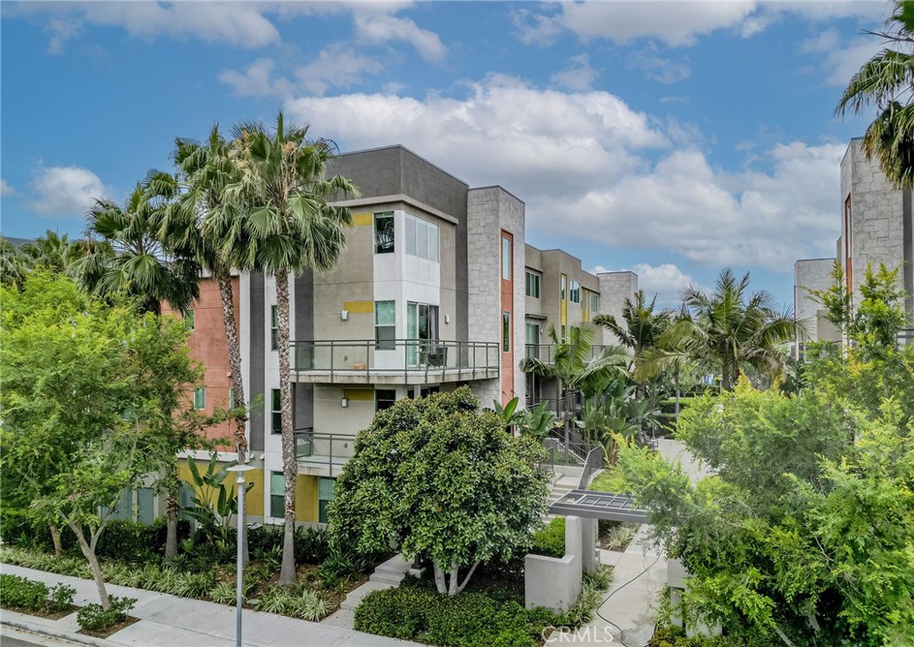 248 Rockefeller Irvine, CA 92612 - Photo 41 of 42 a view of a tall white building next to a yard