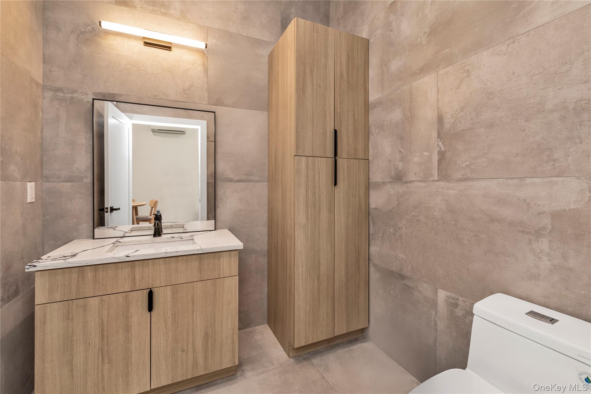 15-27 149th Street Queens, NY 11357 - Photo 12 of 15 a bathroom with a sink toilet and shower