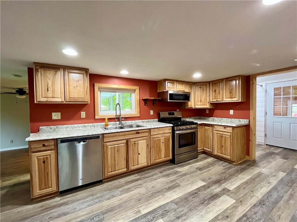 558 Sterling Station Road Sterling, NY 13143 - Photo 15 of 45 Beautiful kitchen cabinets, stainless dishwasher, microwave and refrigerator included.