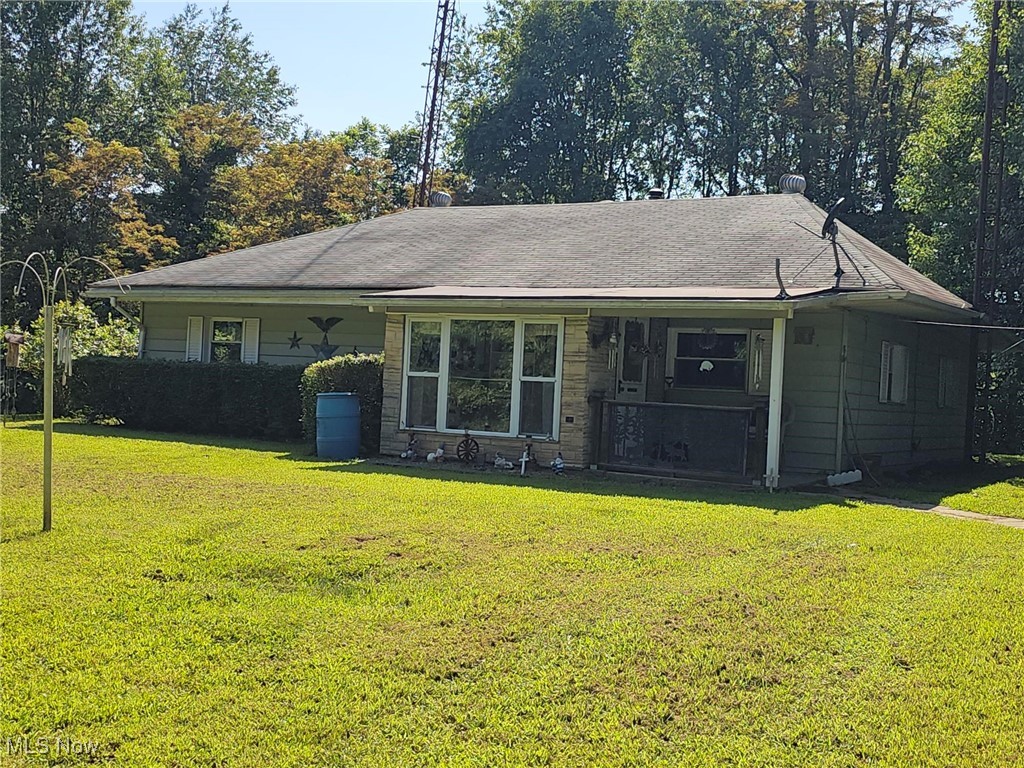 91510 Amos Road Scio, OH 43988 - Photo 1 of 12 View of front facade with a front yard and covered porch