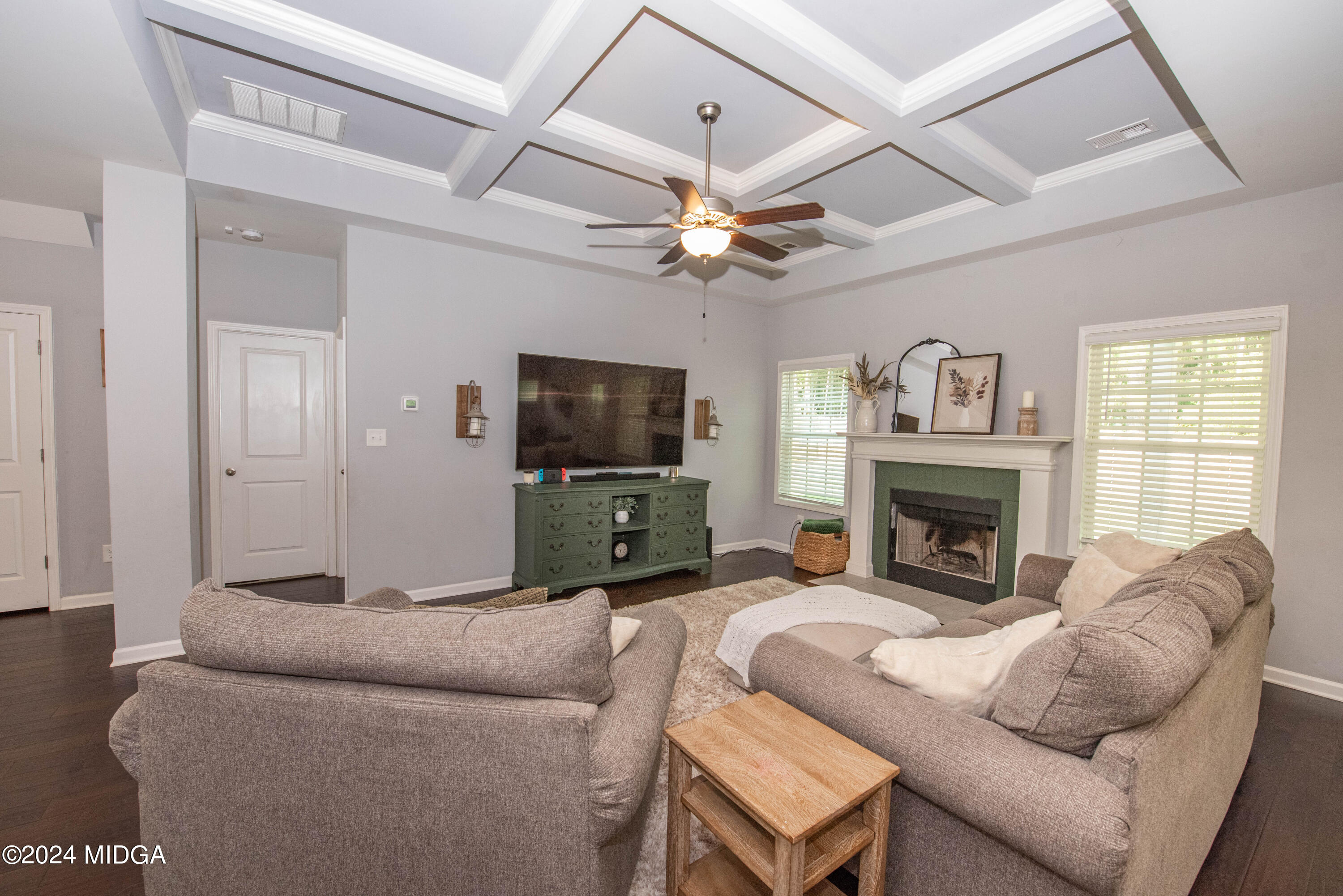 103 Wax Myrtle Way Perry, GA 31069 - Photo 11 of 62 a living room with furniture a fireplace and a flat screen tv