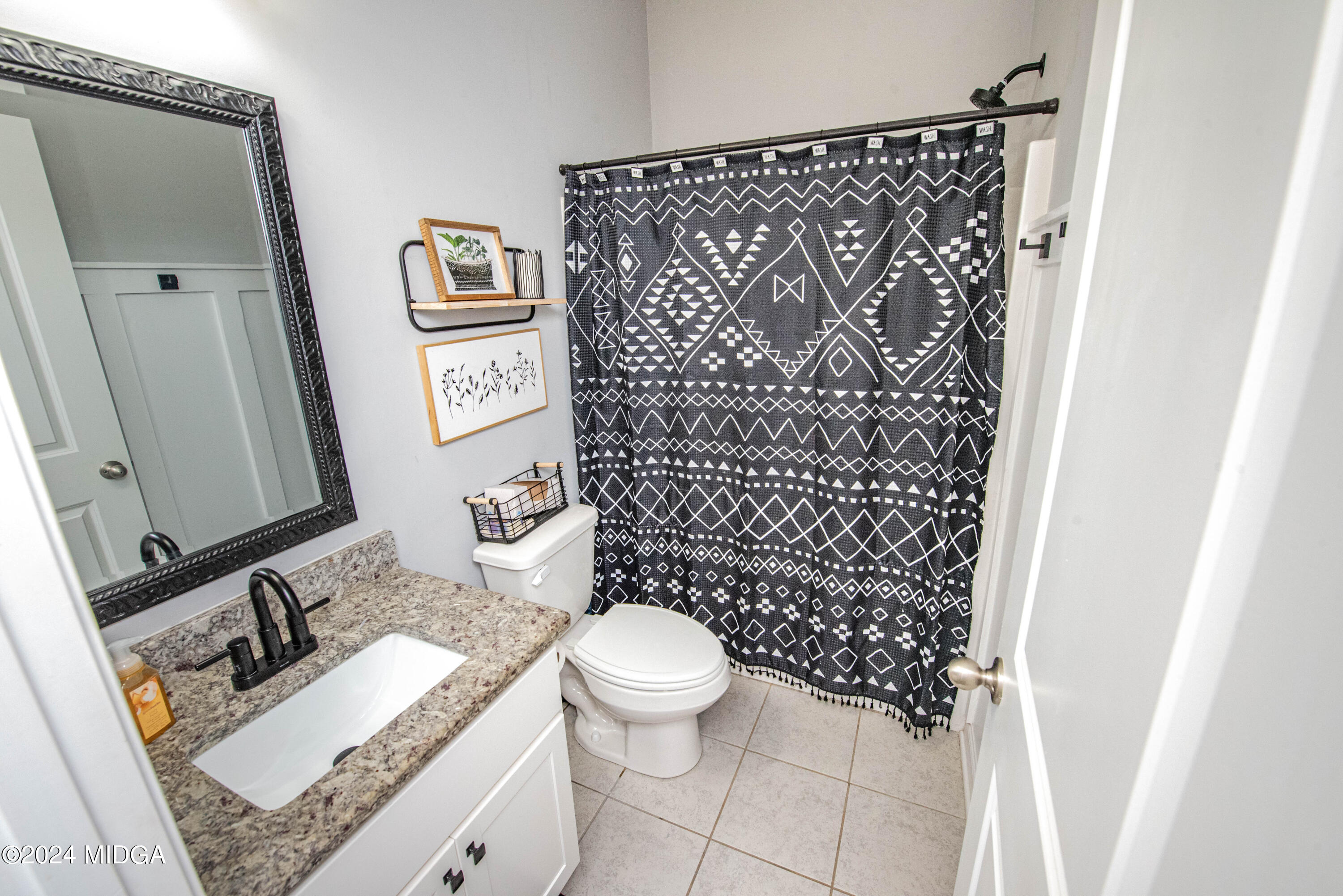 103 Wax Myrtle Way Perry, GA 31069 - Photo 20 of 62 a bathroom with a granite countertop sink and a mirror