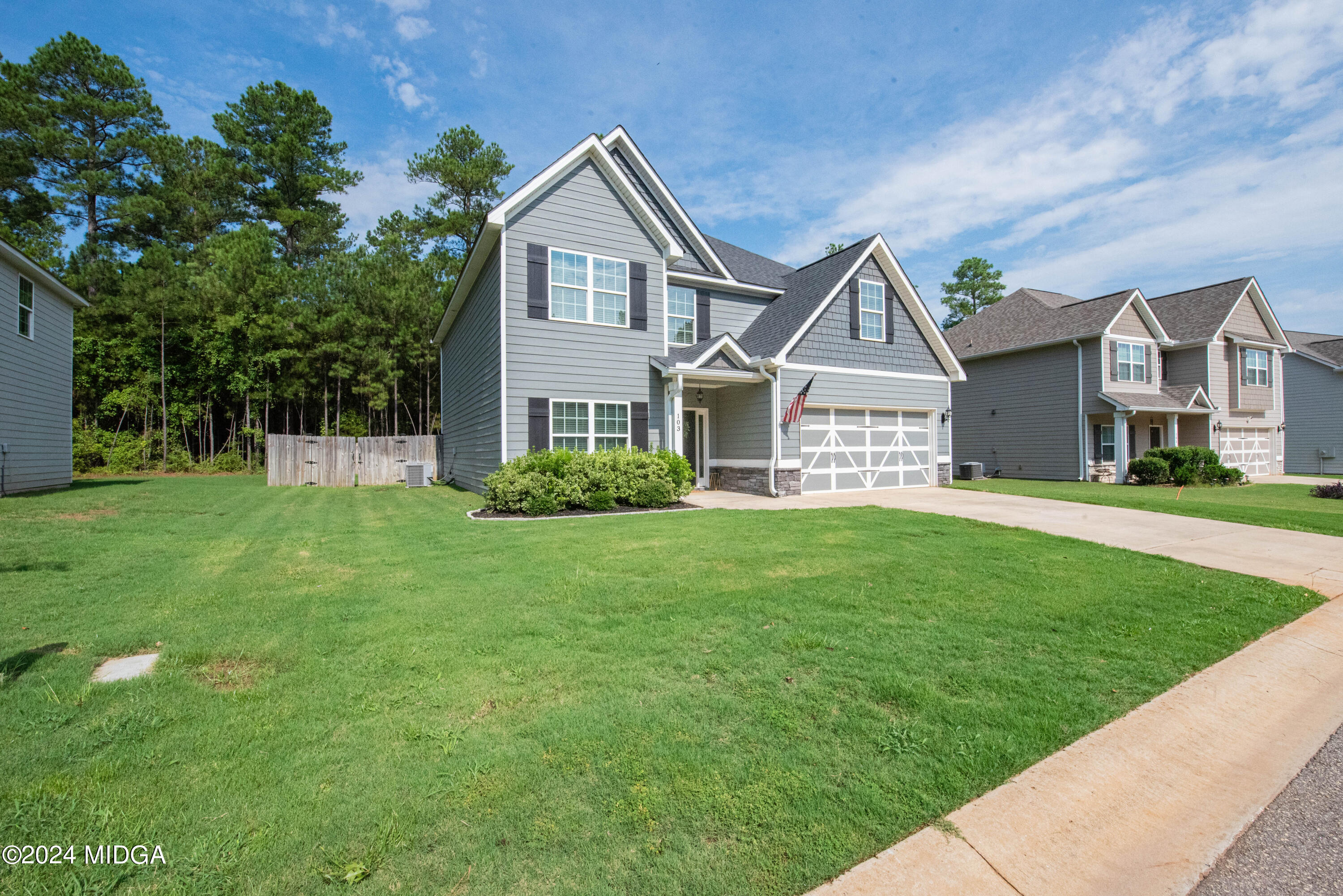 103 Wax Myrtle Way Perry, GA 31069 - Photo 2 of 62 a front view of a house with a yard