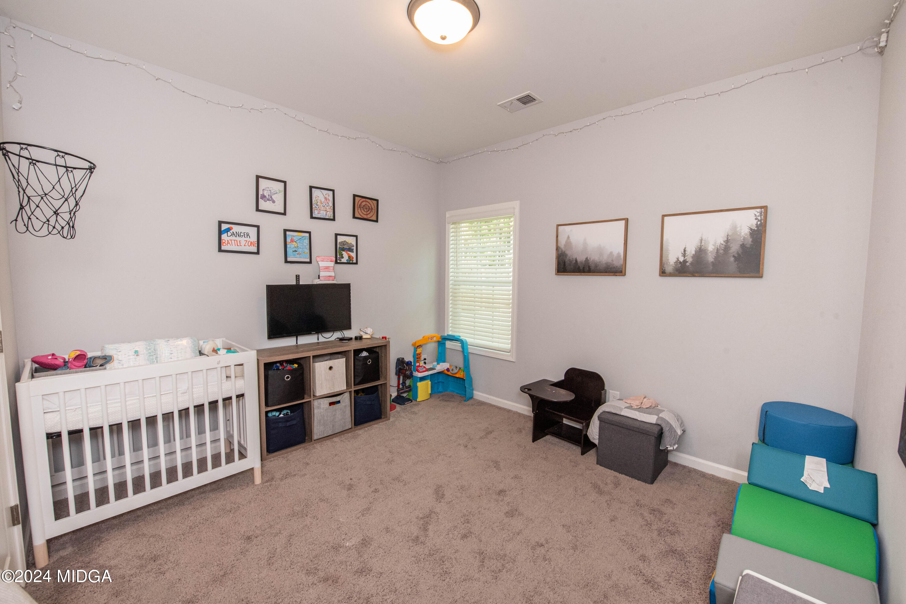 103 Wax Myrtle Way Perry, GA 31069 - Photo 21 of 62 a bedroom with furniture and a flat screen tv
