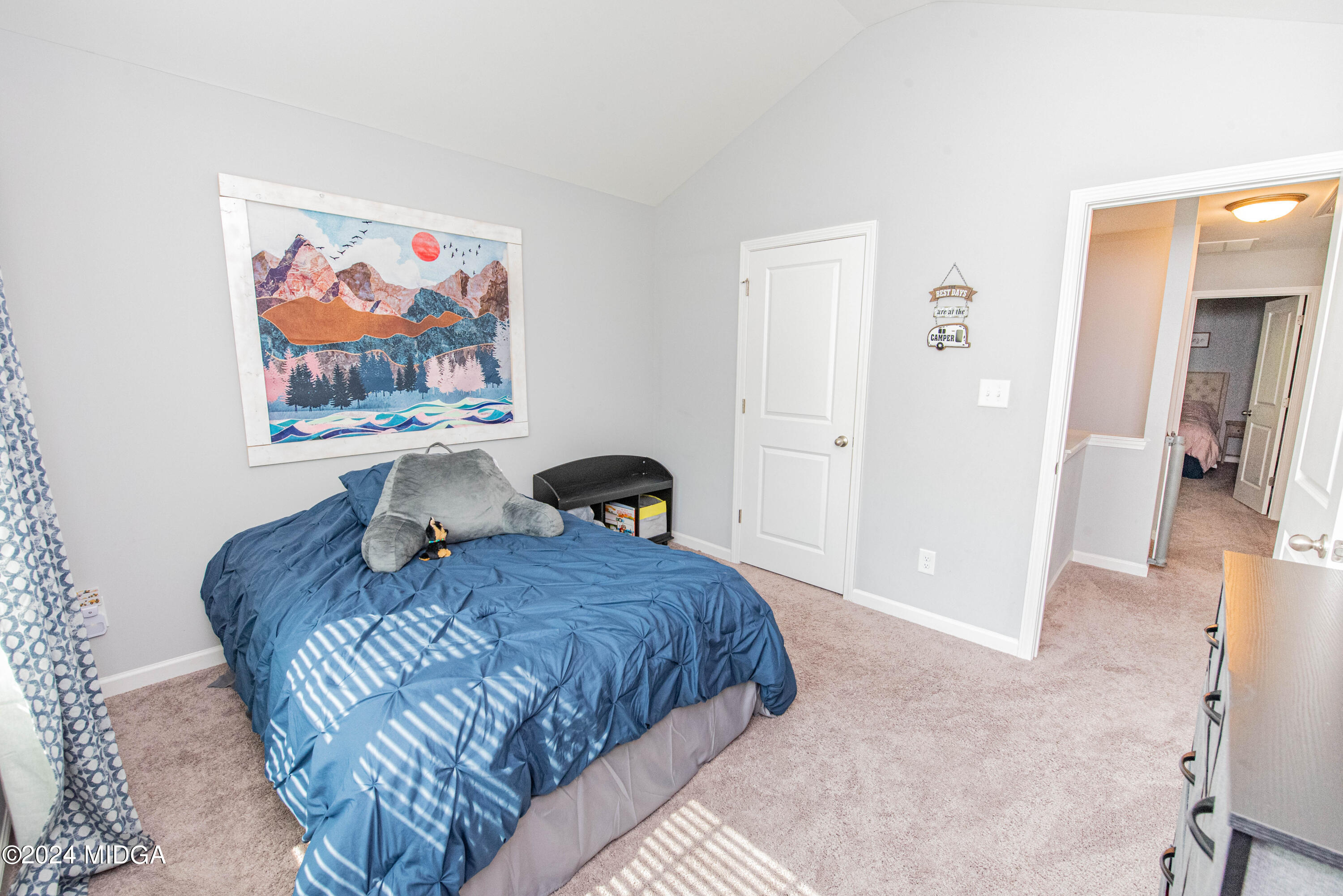 103 Wax Myrtle Way Perry, GA 31069 - Photo 26 of 62 a bed room with a bed and a painting on the wall