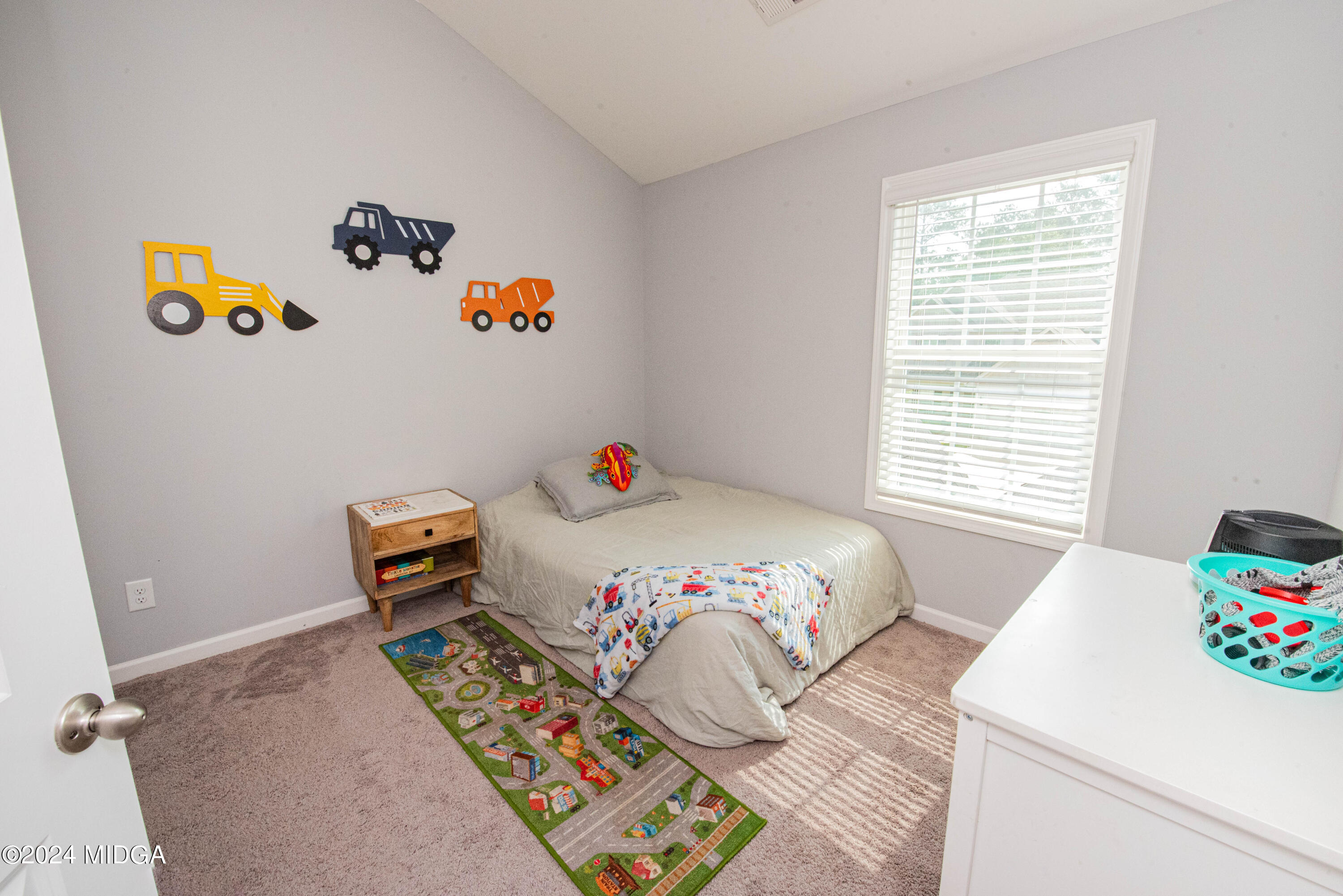103 Wax Myrtle Way Perry, GA 31069 - Photo 27 of 62 a bedroom with a bed and a window