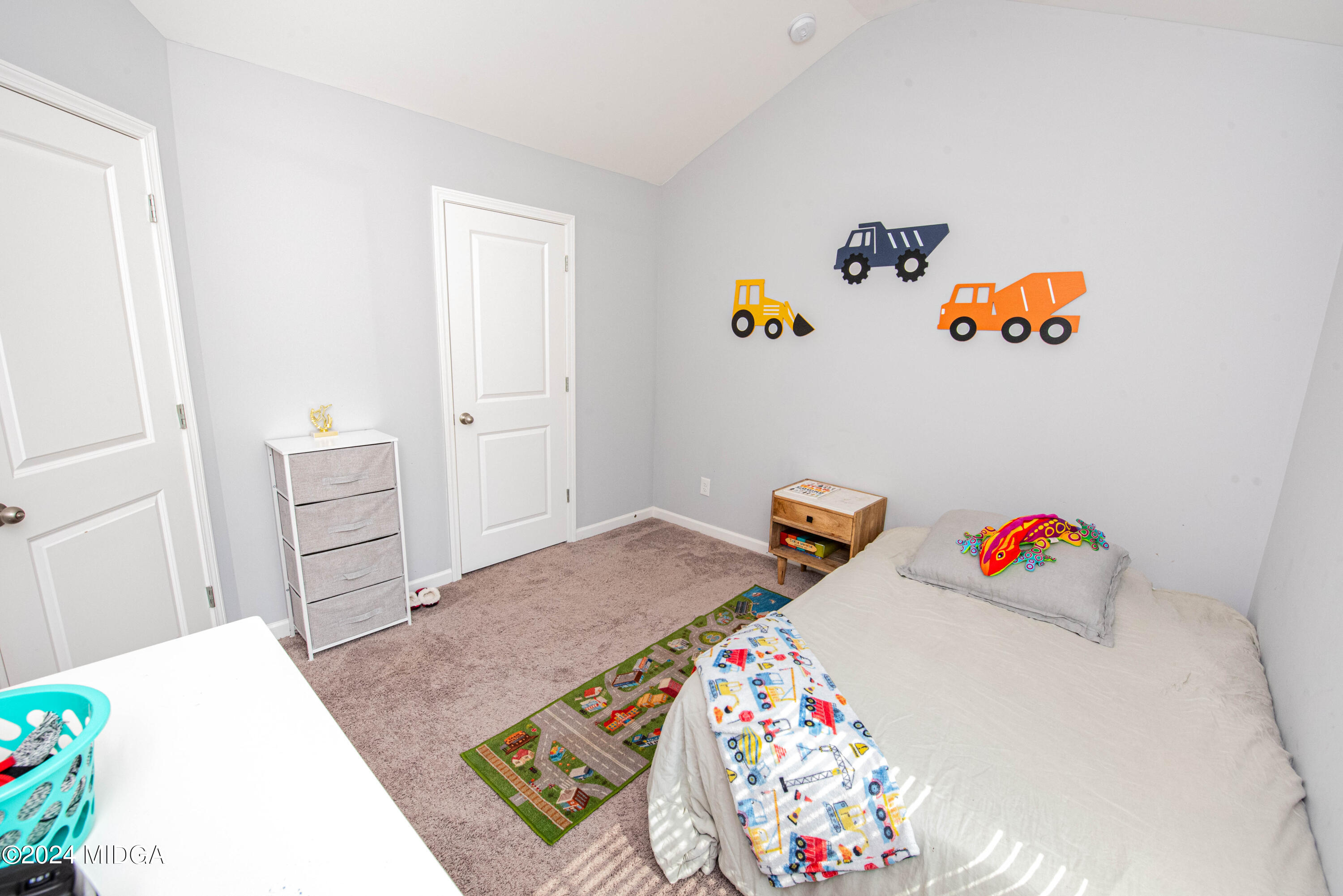 103 Wax Myrtle Way Perry, GA 31069 - Photo 28 of 62 a bedroom with a bed and dresser