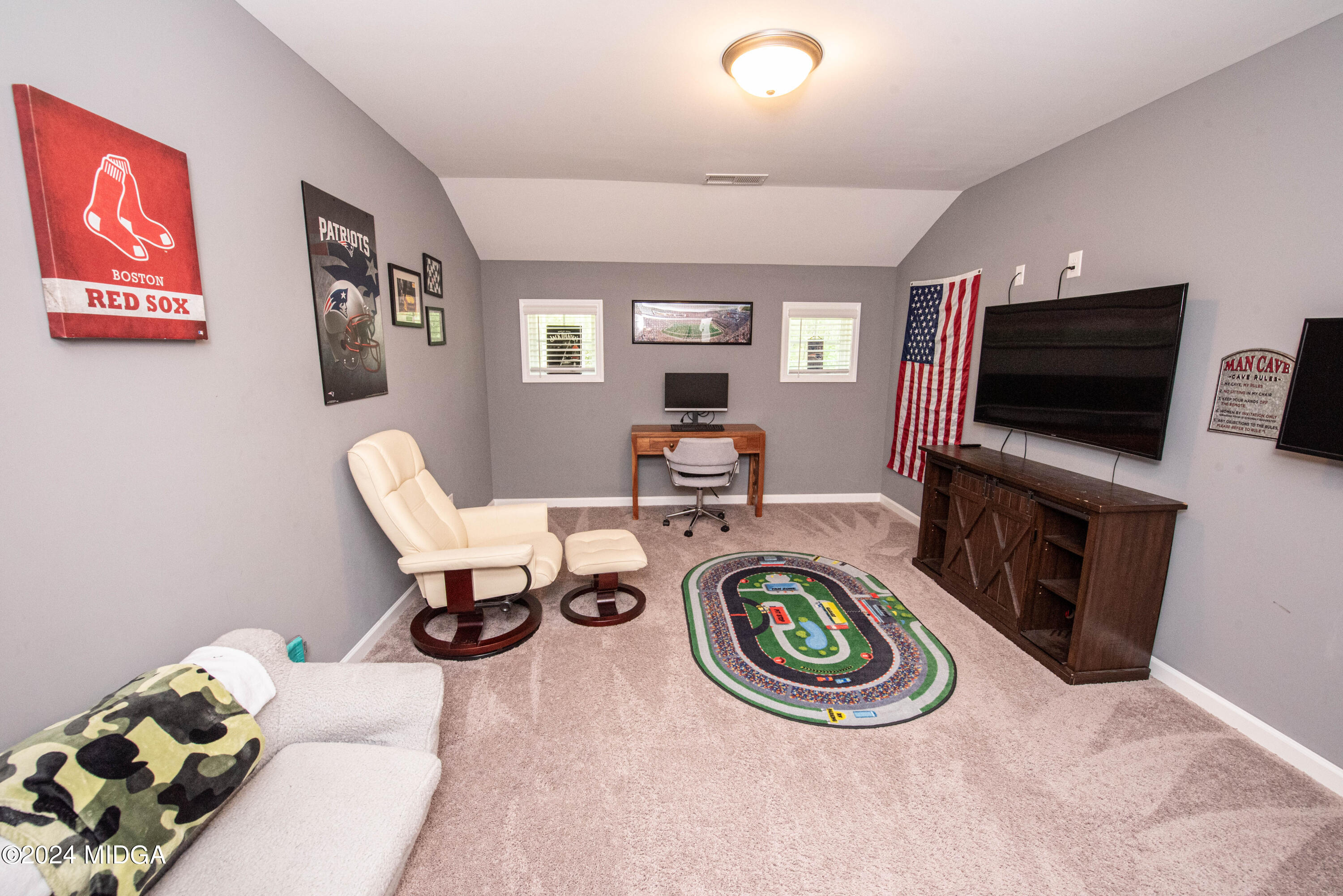 103 Wax Myrtle Way Perry, GA 31069 - Photo 29 of 62 a living room with furniture and a flat screen tv