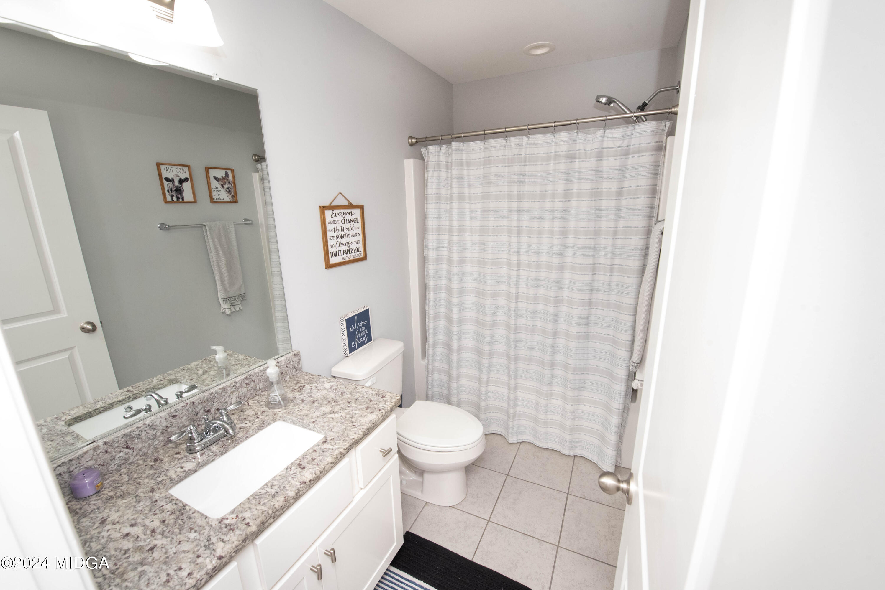 103 Wax Myrtle Way Perry, GA 31069 - Photo 30 of 62 a bathroom with a granite countertop sink toilet and shower