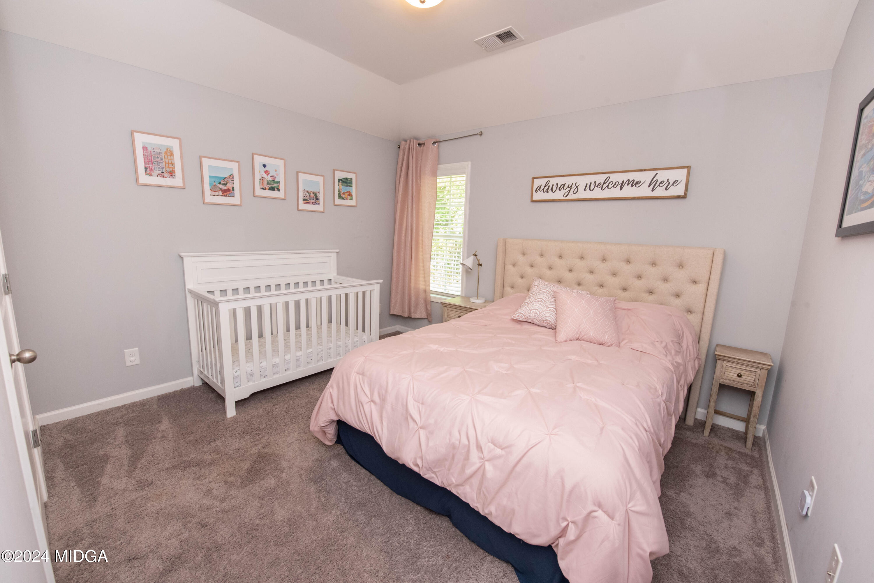 103 Wax Myrtle Way Perry, GA 31069 - Photo 31 of 62 a bedroom with a bed and window