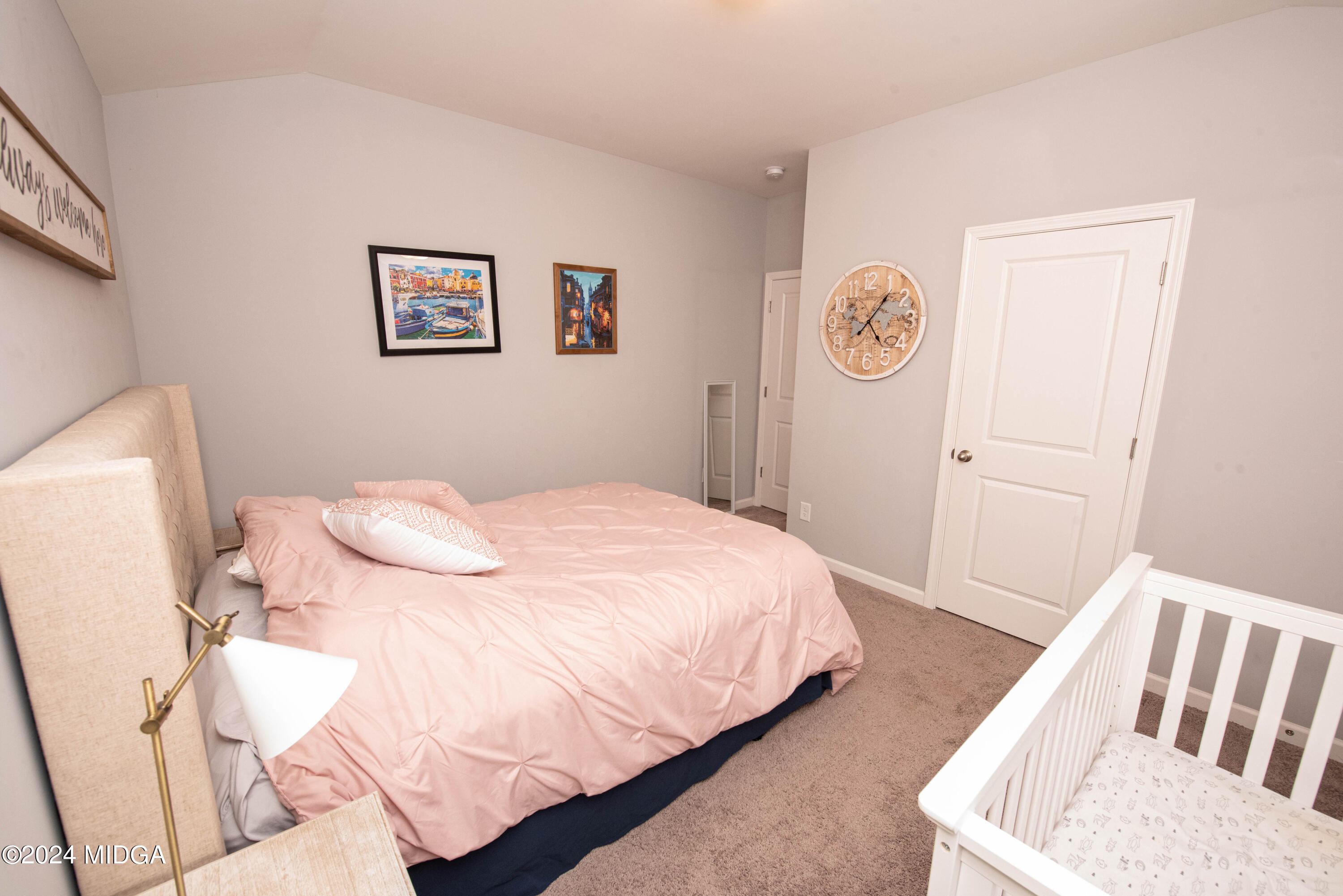 103 Wax Myrtle Way Perry, GA 31069 - Photo 33 of 62 a bedroom with a bed and a chair