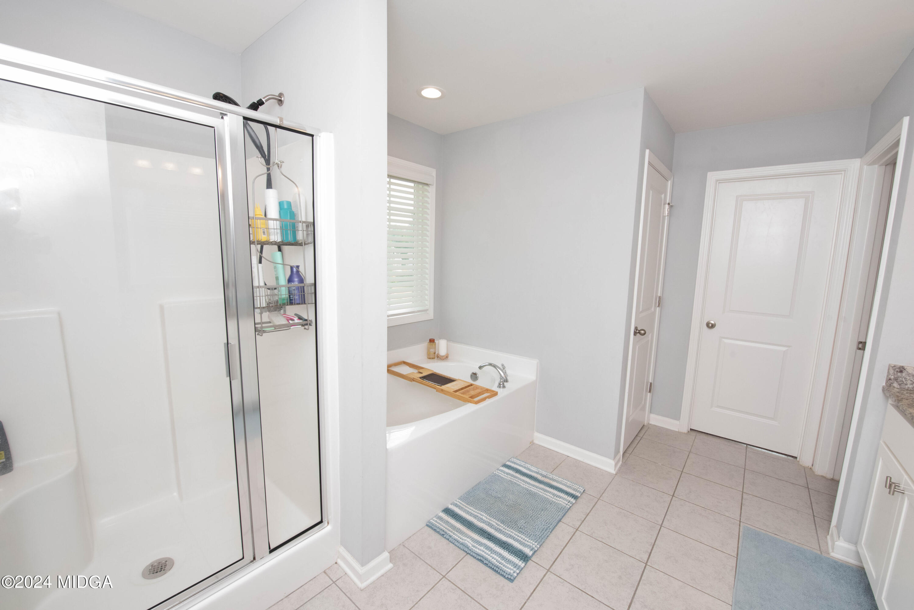 103 Wax Myrtle Way Perry, GA 31069 - Photo 39 of 62 a bathroom with a shower and a sink