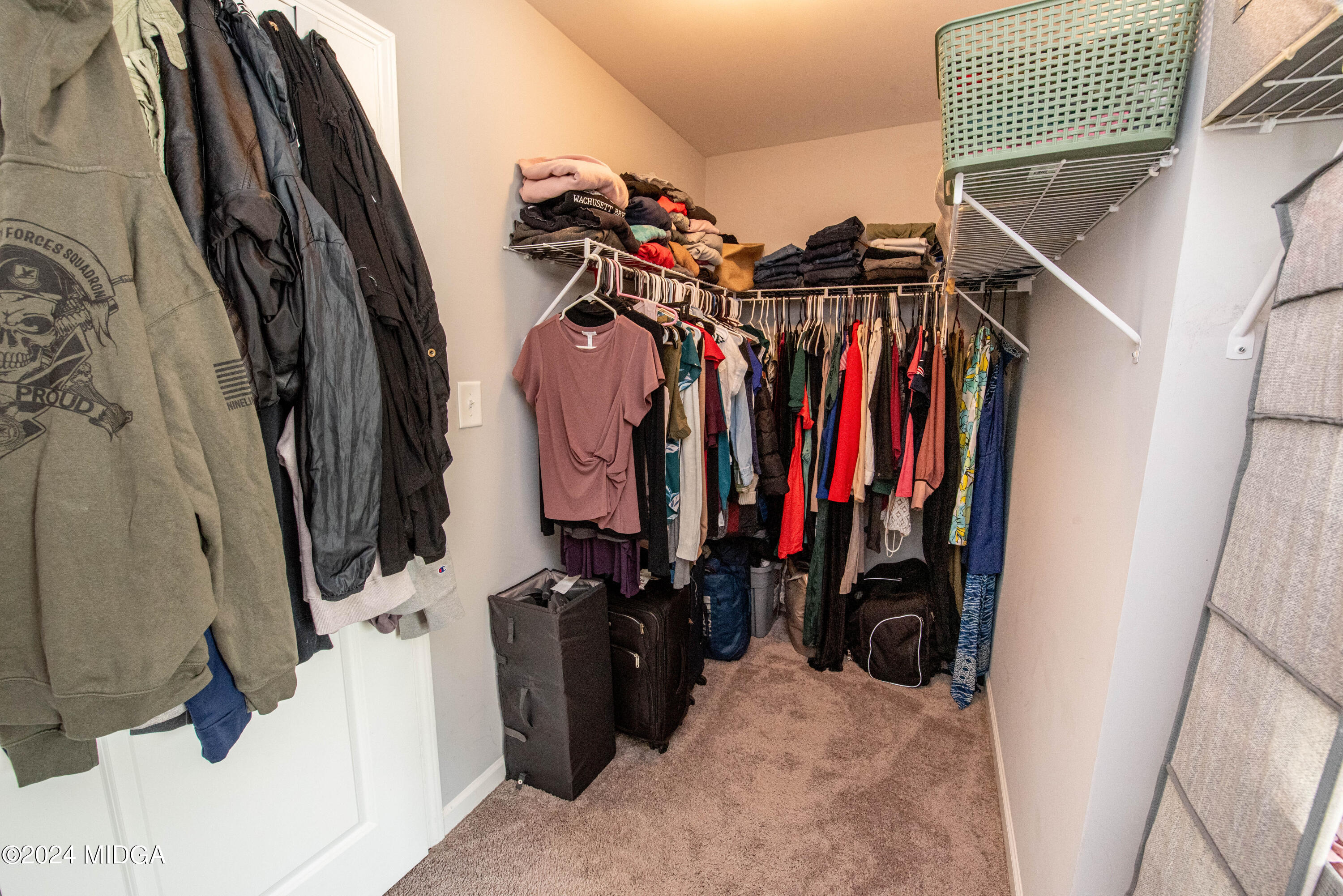103 Wax Myrtle Way Perry, GA 31069 - Photo 46 of 62 a view of walk in closet with clothes and shoes