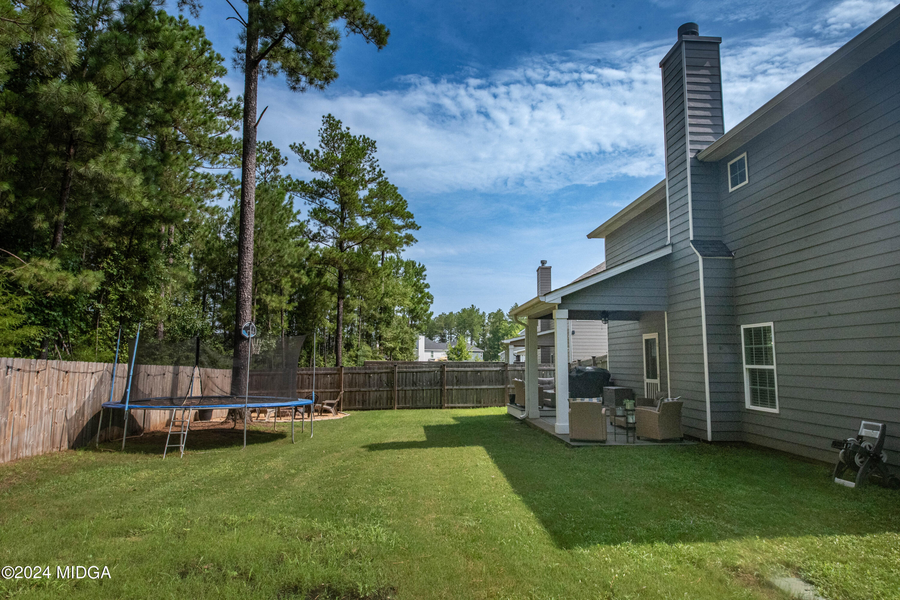 103 Wax Myrtle Way Perry, GA 31069 - Photo 52 of 62 a view of a backyard with a garden and entertaining space