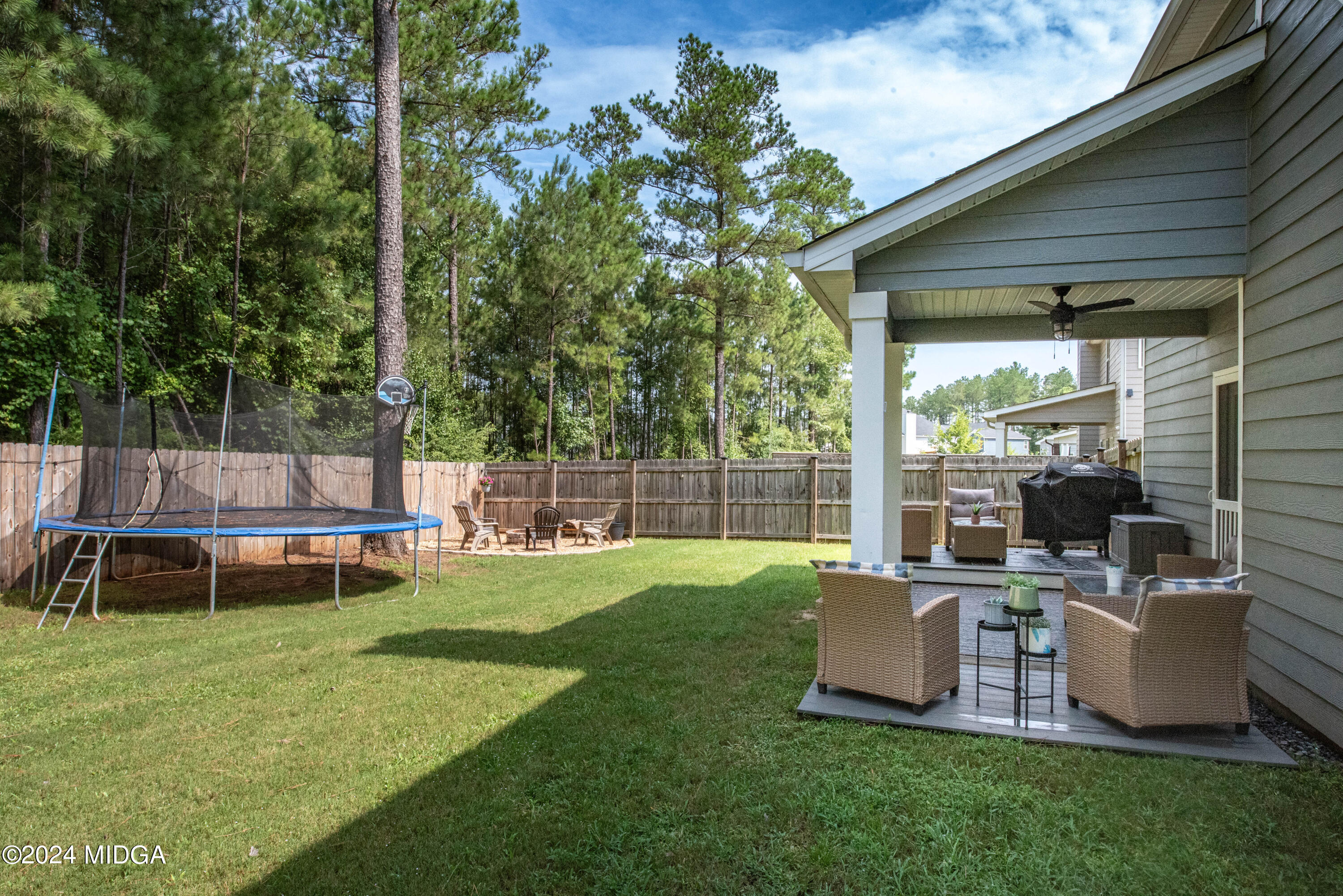 103 Wax Myrtle Way Perry, GA 31069 - Photo 53 of 62 a view of a chair and table in the garden