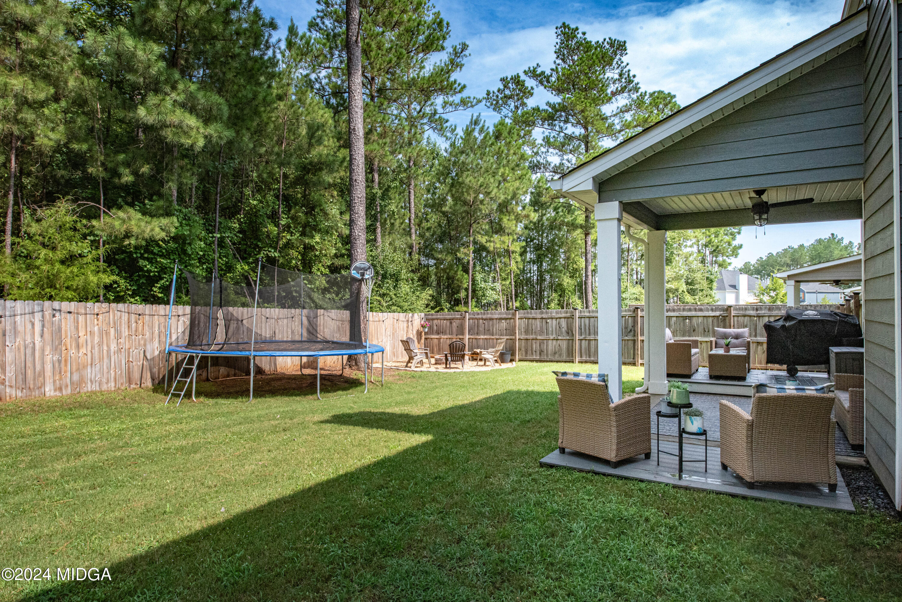 103 Wax Myrtle Way Perry, GA 31069 - Photo 54 of 62 a view of a chair and table in the garden