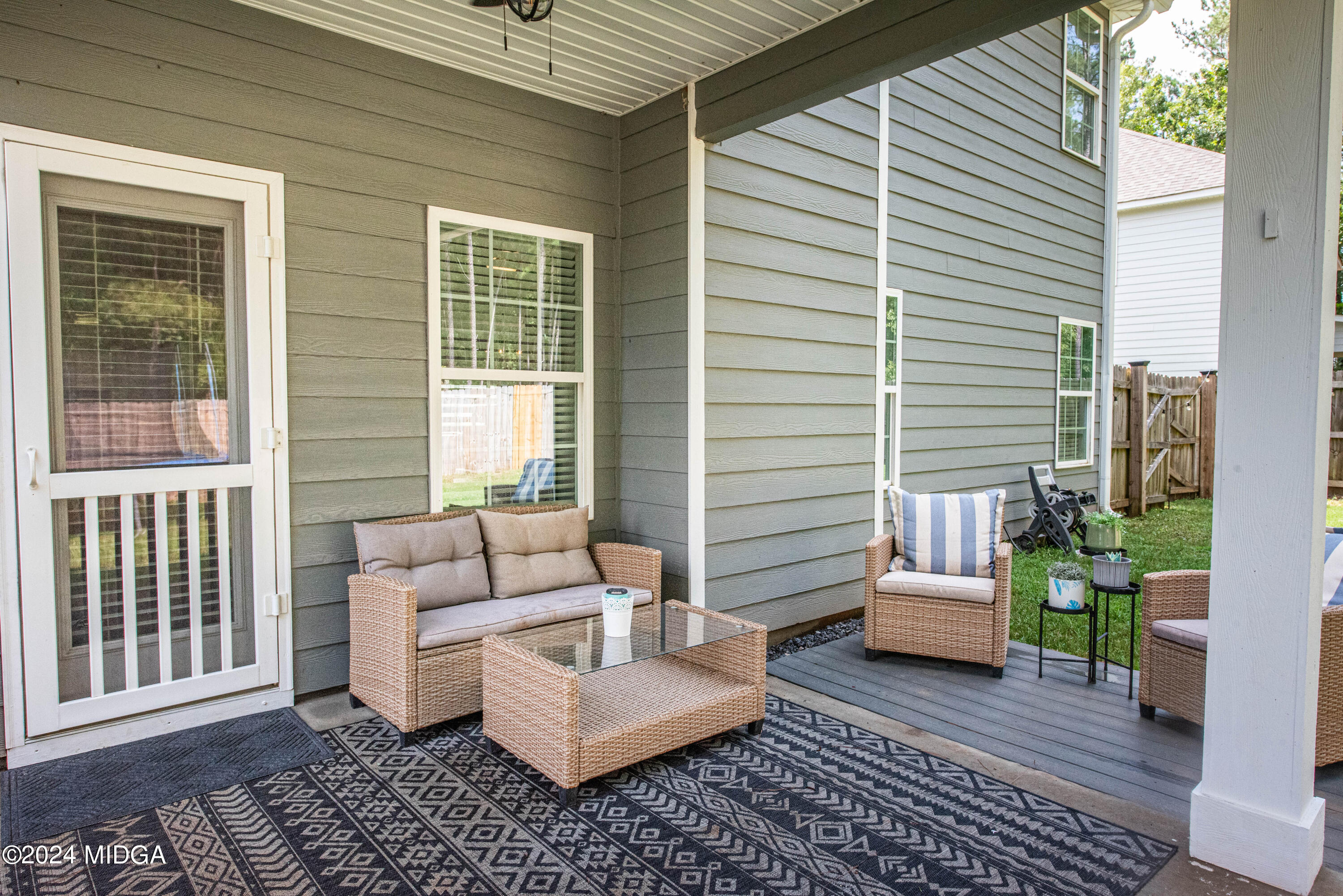 103 Wax Myrtle Way Perry, GA 31069 - Photo 55 of 62 a view of a patio with couches and a potted plant on a table