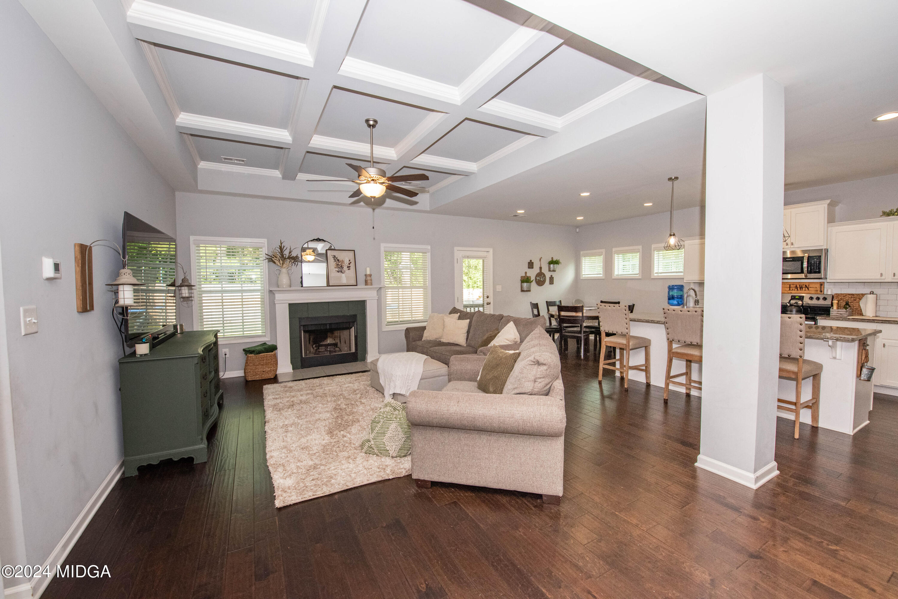 103 Wax Myrtle Way Perry, GA 31069 - Photo 6 of 62 a living room with furniture wooden floor and a fireplace