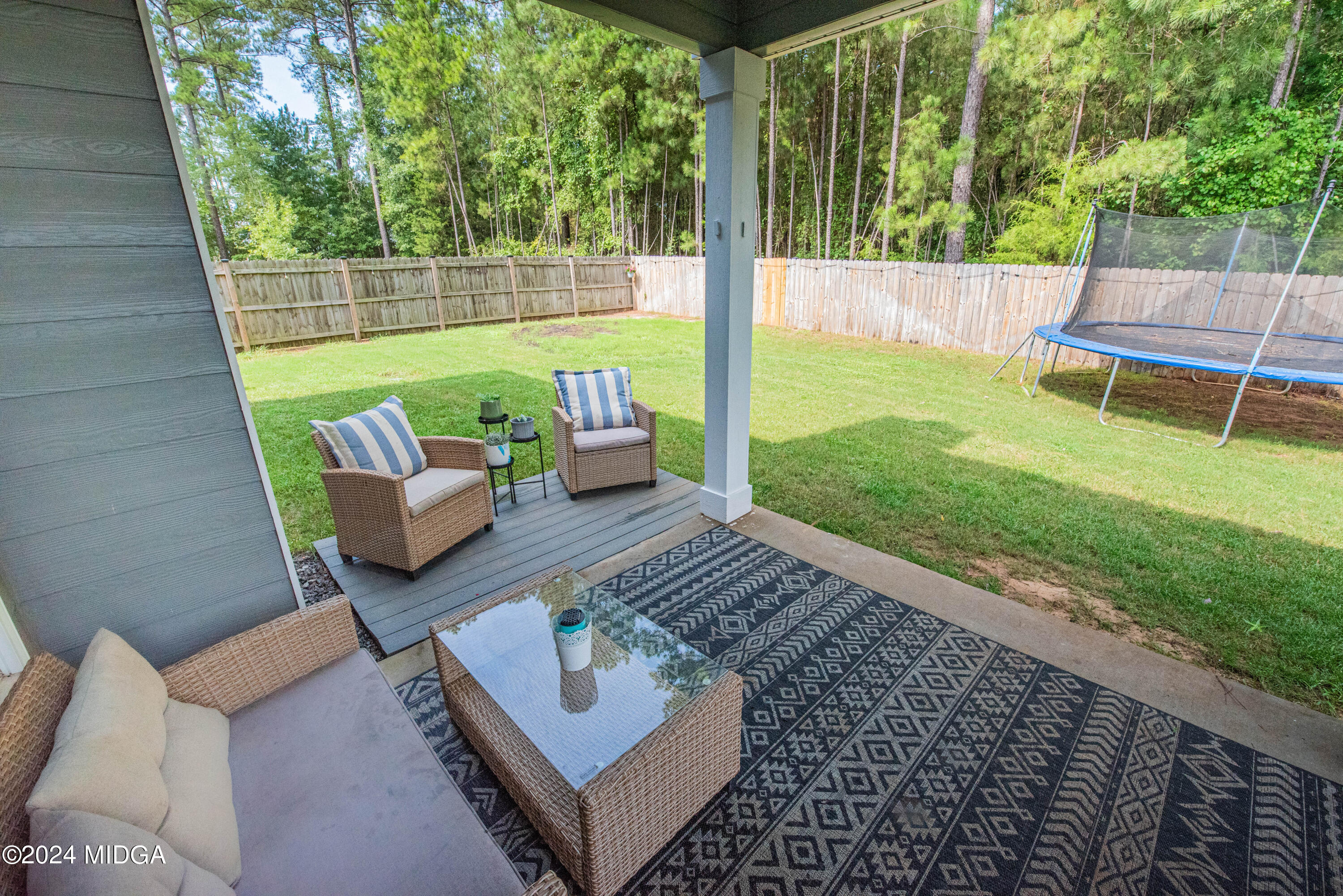 103 Wax Myrtle Way Perry, GA 31069 - Photo 62 of 62 a view of a patio with couches chairs and a yard