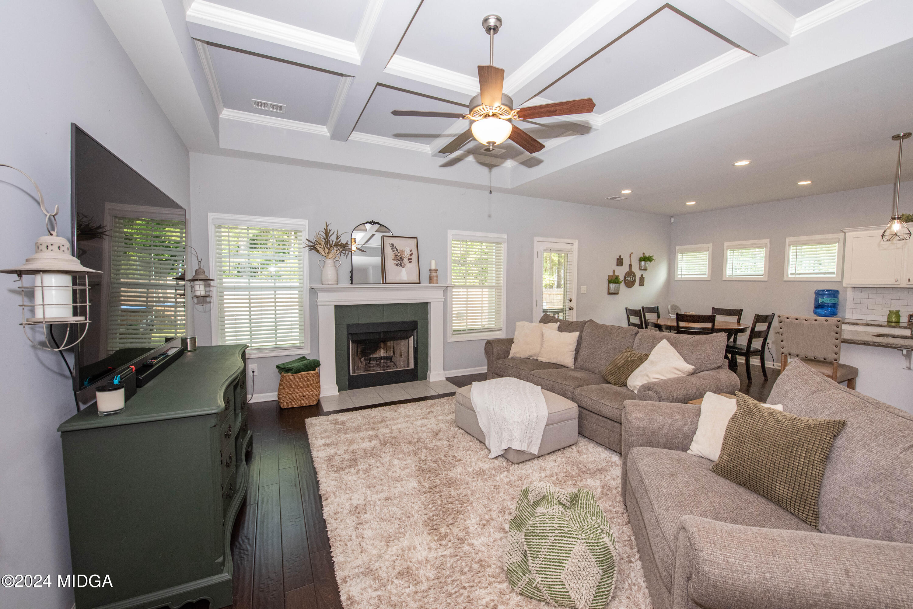 103 Wax Myrtle Way Perry, GA 31069 - Photo 7 of 62 a living room with furniture a fireplace and a flat screen tv