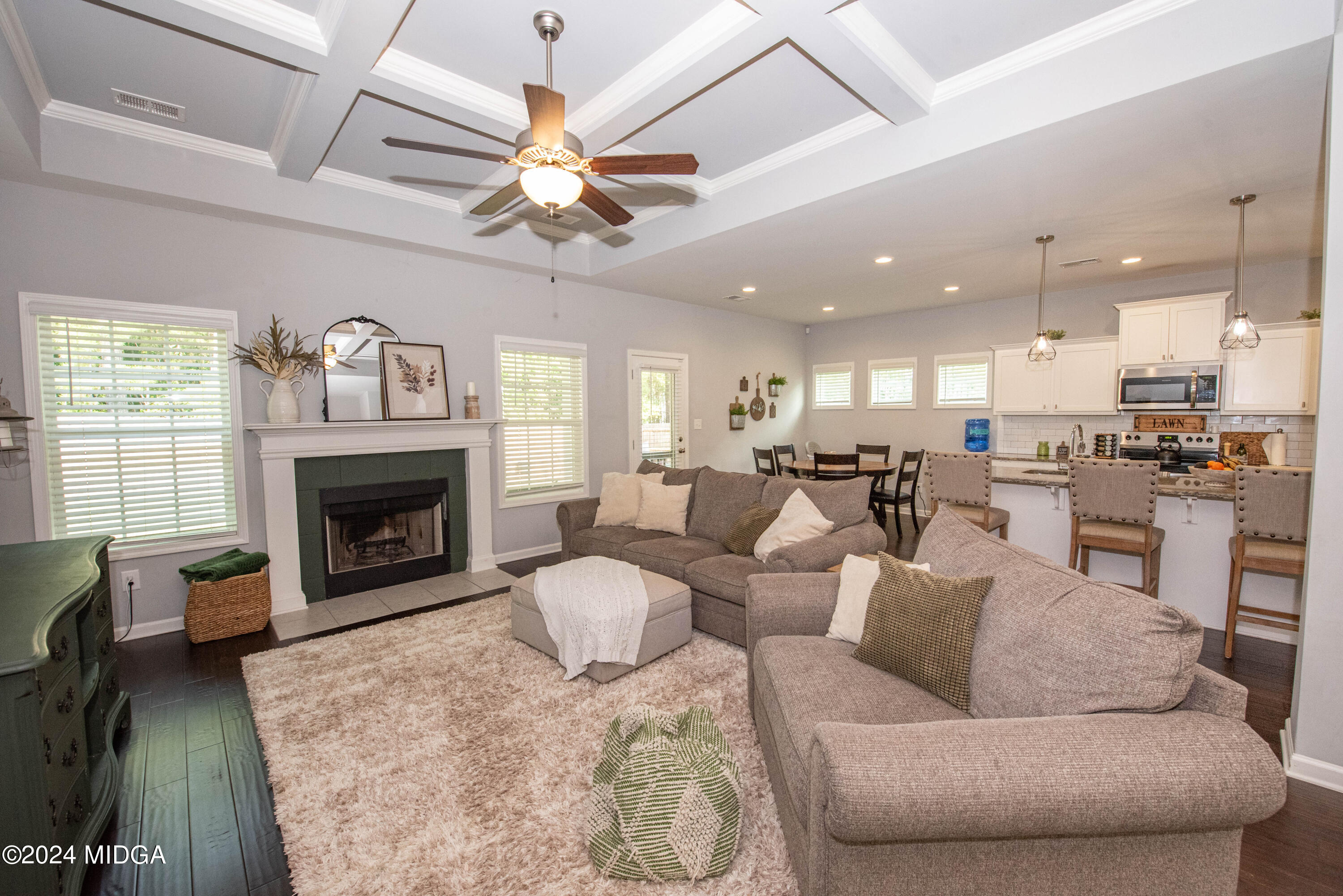 103 Wax Myrtle Way Perry, GA 31069 - Photo 8 of 62 a living room with furniture a fireplace and a chandelier