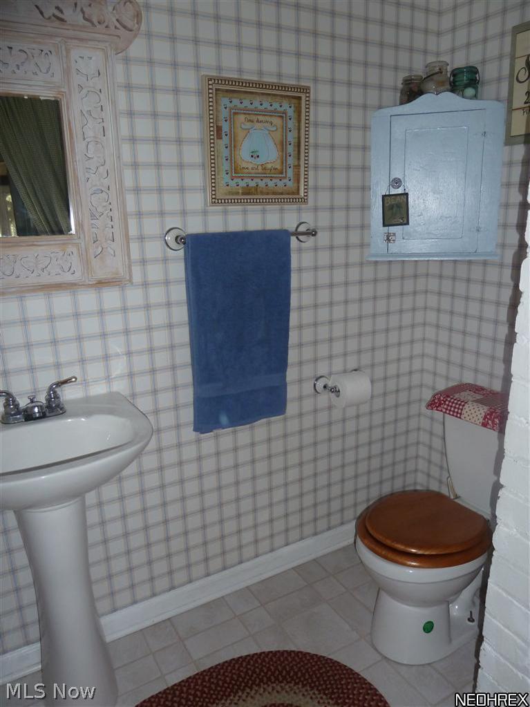 451 West Riddle Avenue Ravenna, OH 44266 - Photo 10 of 25 Convenient half bath off the kitchen