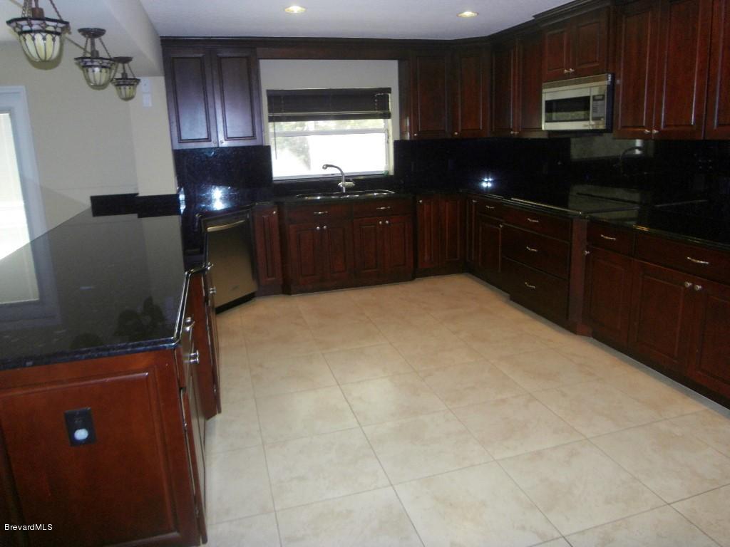 3080 Rio Palma South Melbourne, FL 32903 - Photo 4 of 22 Upscale Kitchen with Breakfast Bar