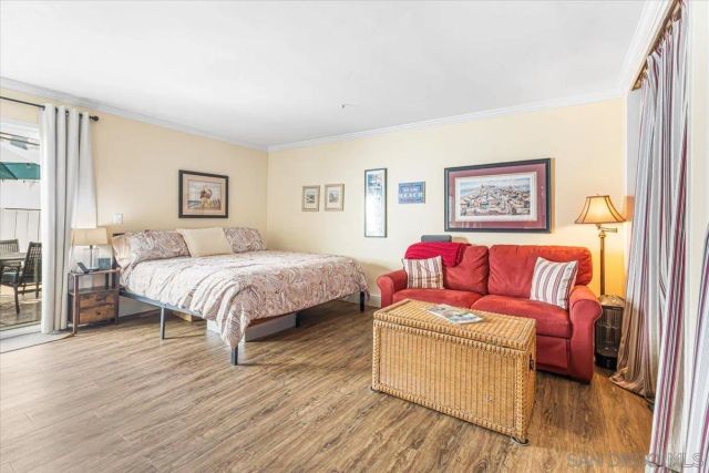 a bedroom with a bed and a couch