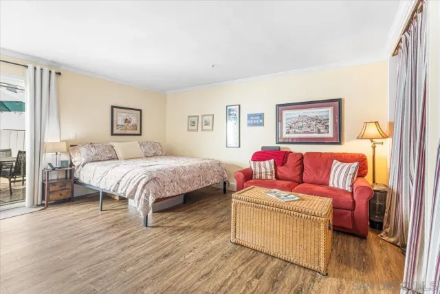 a bedroom with a bed and a couch