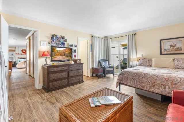 a bedroom with a bed and furniture