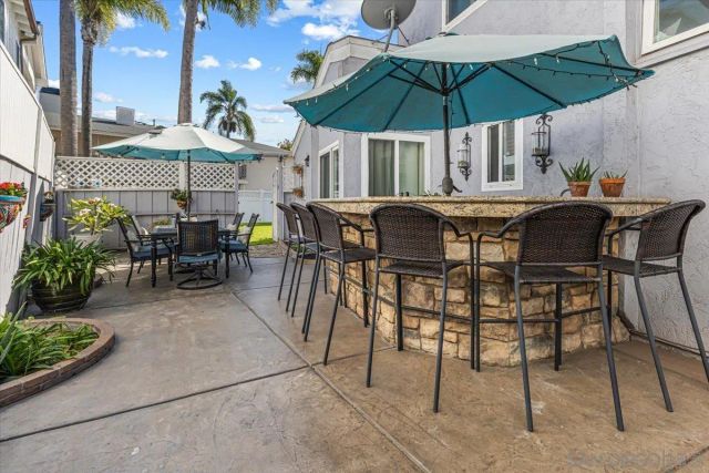 an outdoor space with furniture and umbrella