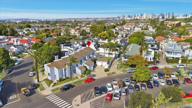 an aerial view of residential houses with outdoor space