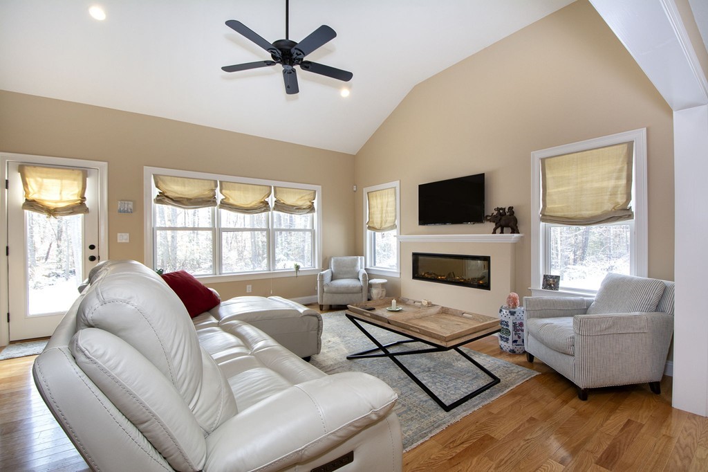 4 Kevin's Way, Unit 4 Scituate, MA 02066 - Photo 16 of 26 a living room with furniture fireplace and a flat screen tv