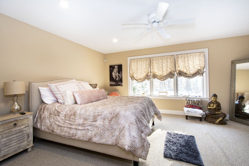 4 Kevin's Way, Unit 4 Scituate, MA 02066 - Photo 19 of 26 a bedroom with a bed couch and window