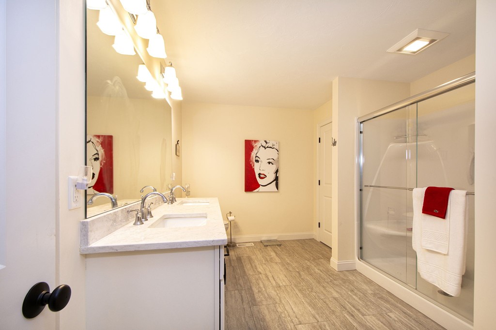 4 Kevin's Way, Unit 4 Scituate, MA 02066 - Photo 20 of 26 a bathroom with a sink and a mirror