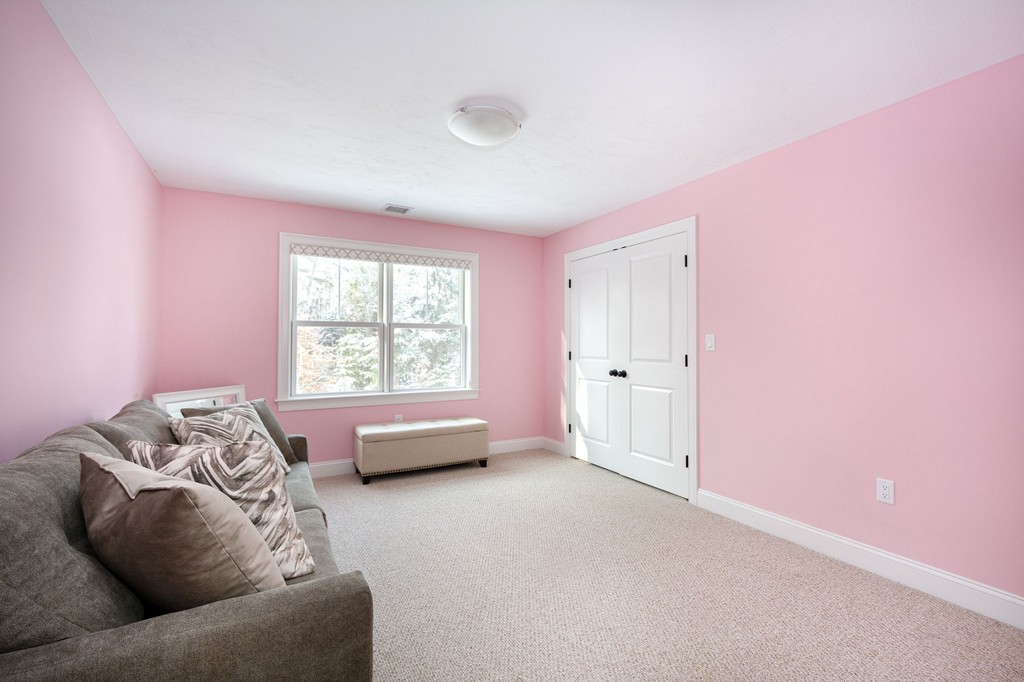 4 Kevin's Way, Unit 4 Scituate, MA 02066 - Photo 22 of 26 a living room with furniture and a window