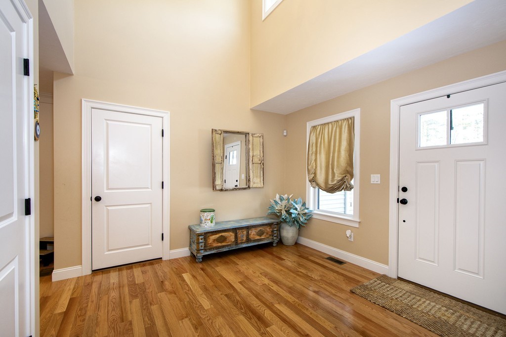 4 Kevin's Way, Unit 4 Scituate, MA 02066 - Photo 7 of 26 a view of a room with wooden floor and window