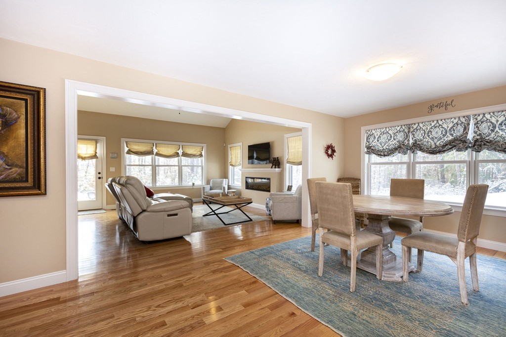 4 Kevin's Way, Unit 4 Scituate, MA 02066 - Photo 8 of 26 a living room with fireplace furniture and a wooden floor
