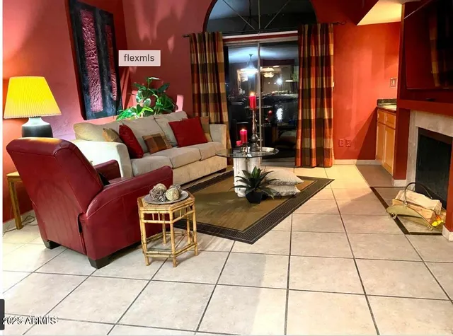 a outdoor living space with furniture and a fireplace