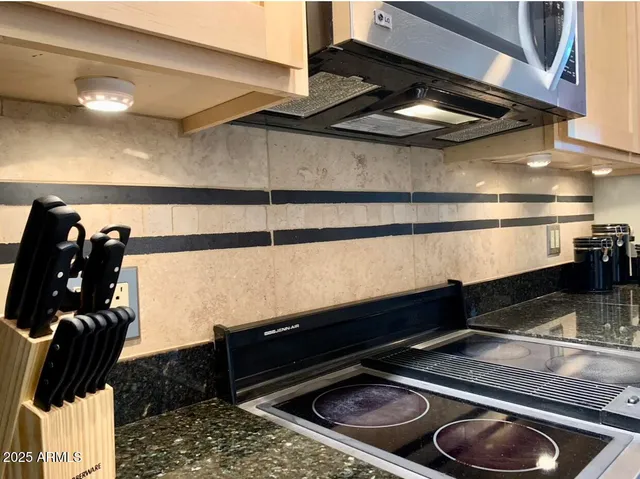 a view of a dining room with furniture and window