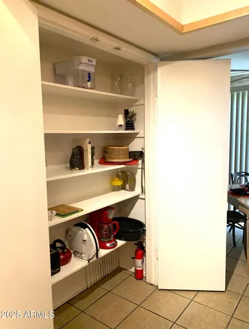 a bedroom with a bed and a night stand