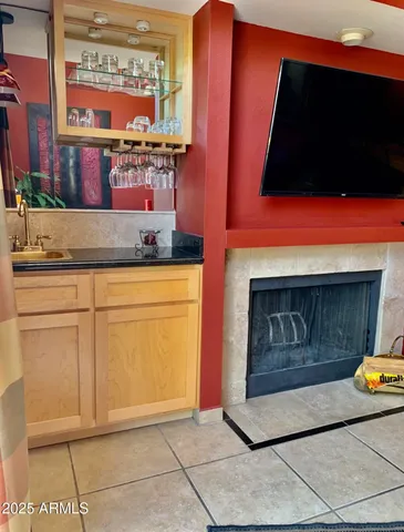 a kitchen with granite countertop a stove a microwave and cabinets