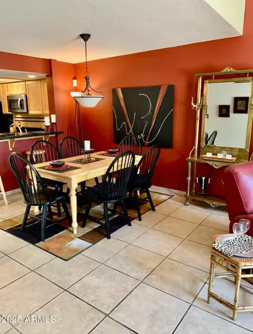 a patio with table and chairs