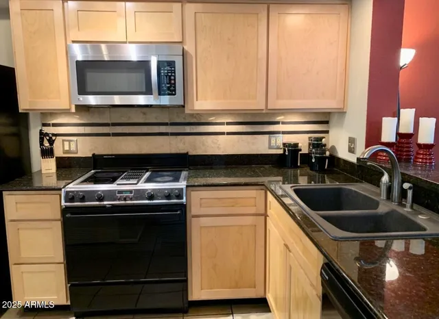 a kitchen with a stove and a microwave